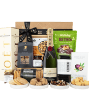  Byron Bay Gifts Gourmet<br>Delight Hamper  750ML Introducing the Gourmet Delight Hamper, a true celebration of indulgence and refinement. This gift hamper is a carefully curated selection of the finest gourmet treats, sourced from local, Australian producers and presented in a beautiful gift box.<br>The hamper includes an impressive array of savory and sweet delights, including crispbreads, chutney's and gourmet nuts.<br>For the sweet tooth, the hamper offers a delightful selection of artisanal chocolates, biscuits and cookies.<br>Presented in