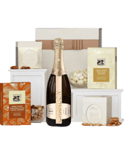  The Hamper Emporium Chandon<br>Celebration  750ML Lovers of Chandon will be delighted to receive this Chandon hamper. Inside the premium box lies a bottle of their favourite sparkling wine. After they pop the top, pour a glass, and toast, they can sample the selection of sweet nuts and nibbles included in the hamper. Our favourite is Maggie Beer's Burnt Toffee Popcorn & Cocoa Dusted Cashews. Cheers! <br> Due to popular demand and seasonal variation, hamper contents may vary. Enjoy food before the use-by date. Please note that this hamper contai