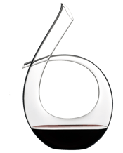  Riedel Decanter Black Tie<br>1.95l   Crystal glass, mouth blown, handmade. Classic, curved, and crucial to wine enjoyment, Riedel's Black Tie decanter makes decanting a joy. It features Riedels signature Black Tie design, a tuxedo line dramatically swooping through the decanters lines. PLEASE NOTE: due to the hand-crafting, small tolerances in the size and weight of the piece, and slight imperfections and variations, are a feature and acceptable part of the process.