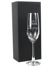 Personalised Favours Flute<br>Glass Gift Boxed - 'but... Take you champagne toast to the next level with this elegant, tapered stem champagne glass. Made from premium European glass, this is a timeless gift that will be treasured forever by the lucky recipient. Ideal for birthdays, house warmings and engagements. Each glass is safely packaging inside a stylish black gift box. The glass has been carefully laser engraved with the text 'But First, Champagne’. Measurements: - Champagne Glass - (5 diameter x 23.5h cm).