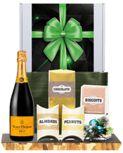  Hamper World Veuve Clicquot<br>Brut Gourmet... 750ML This Gourmet Hamper contains 1 bottles of alcohol and 4 food products and is packaged in a Medium White Gift Box which is Finished with a Seasonal Event Sleeve.<br>Veuve Clicquot Brut 750mL<br>Morish Treats Milk and Dark Chocolate Bites 120g<br>Morish Treats Assorted Jam Filled Biscuits 150g<br>Morish Treats Milk Chocolate Almonds 75g<br>Morish Treats Milk Chocolate Peanuts 75g