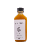  Old Bones Chilli Co Buffalo<br>Sauce 100ml  100ML Old Bones Buffalo Sauce is made using the perfect blend of Australian grown cayenne and habanero chillies.<br><br /><br />Bright, smooth and oh-so-buttery (without using any butter), it's perfectly seasoned with a nice kick of heat. Perfect on all things chicken! Try mixing some in a quality mayo and bingo, you have an awesome buffalo mayo for chicken schnitzel burgers, roast potatoes and with your hot chips!