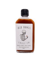  Old Bones Chilli Co Smoked<br>Garlic Chilli... 200ML Made with Australian grown Habanero and Cayenne, using our house crafted smoking method, our Smoked Garlic Chilli sauce is perfectly balanced with a meaty garlic punch, bringing you a full flavoured sauce with a mild palatable burn.<br><br />Whether you need a one stop answer for perfect guac or a zingy garlic twist to your seafood pasta, make this your "secret" ingredient in all your recipes.