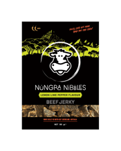  Nungra Nibbles Beef Jerky -<br>Lemon Lime Pepper... 85G Lemon Lime Pepper Beef Jerky – Tangy & Peppery Perfection!<br>Lemon Lime Pepper brings together the vibrant, zesty flavours of fresh lemon and lime, perfectly balanced with the sharp, earthy aroma of cracked peppercorns. The tangy sourness of the citrus is complemented by the woody, piney notes of pepper, creating a refreshing and bold taste. This combination will transport you to a tropical island getaway, where the lively citrus and peppery heat take centre stage.<br>Heat Rating: Medium<br>85g