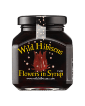  Wild Hibiscus Flowers In<br>Syrup 250g  250mL Place a single flower in the bottom of a champagne glass and watch it blossom and release its sweet nectar into your sparkling wine.