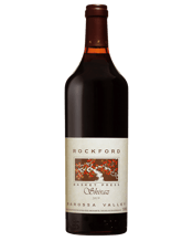  Rockford Basket Press Shiraz<br>Barossa Valley... 750ML The 2019 Rockford Basket Press Shiraz is a profound expression of traditional Barossa winemaking. This vintage was characterized by a warm and dry growing season which resulted in tiny berries with immense flavor concentration. Sourced from a network of independent growers with ancient dry grown vines this Shiraz is still processed using a 100 year old vertical basket press to ensure gentle extraction and a soft mouthfeel.