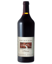  Rockford Basket Press Shiraz<br>2011  750mL Rockford Basket Press Shiraz has garnered a unique and cult following over its lifetime. With its 'old school' brown glass bottle and traditional label, Rockford Basket Press is one for the traditionalists. Big, bold and upfront fruit with all the lashings of chocolate, coffee bean and Christmas cake all have come to adore.